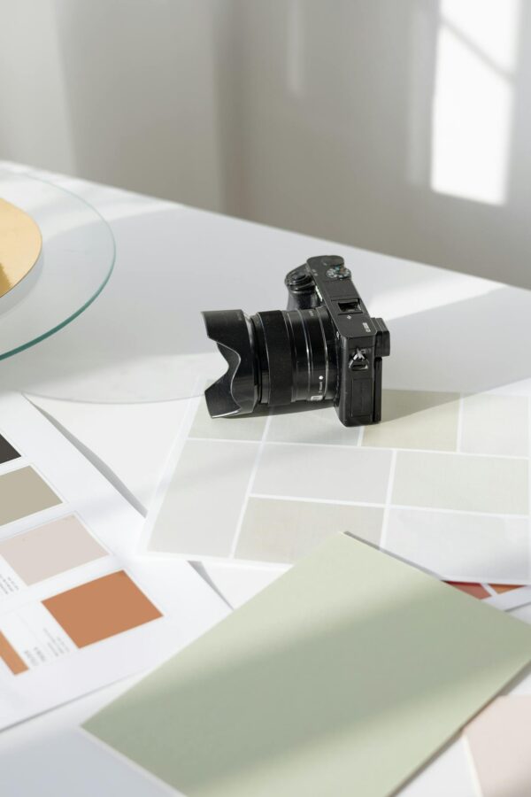 Black Dslr Camera on White Table