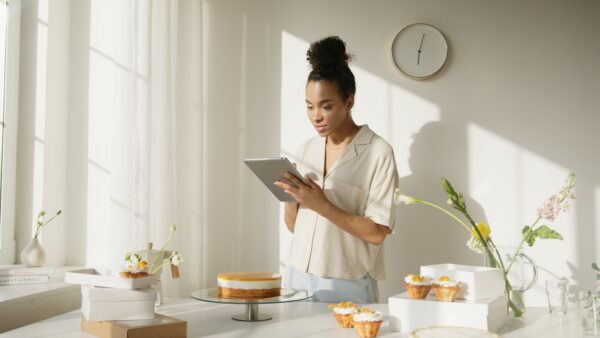 Man in White Shirt Using Silver Ipad