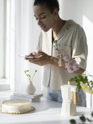 Woman in White Dress Shirt Holding White Smartphone