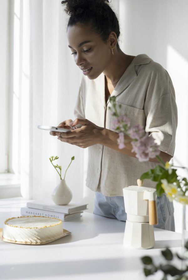 Woman in White Dress Shirt Holding White Smartphone